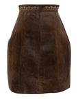 Traditional-style brown leather skirt with structured panels, front zipper, and ornamental stitching at the waist