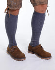 Gray Bavarian socks with ribbed lower and honeycomb knit upper, laid flat on white background.